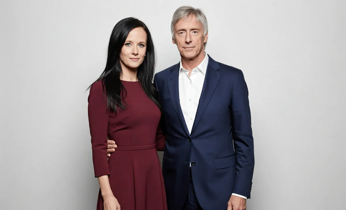 Hannah Andrews, wife of Paul Weller, smiling softly in a candid photograph, highlighting her private lifestyle.